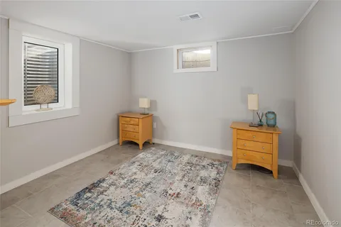 a room with a window and a cabinet in it