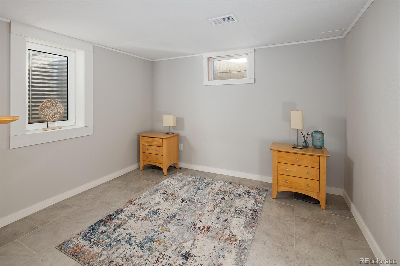 1550 South Forest Street Denver, CO 80222 - Photo 32 of 38 a room with a window and a cabinet in it