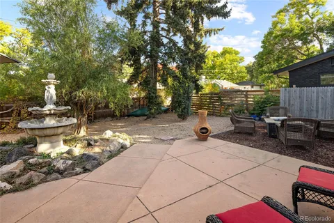 a backyard of a house with seating space