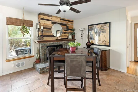 a dining room with furniture and window