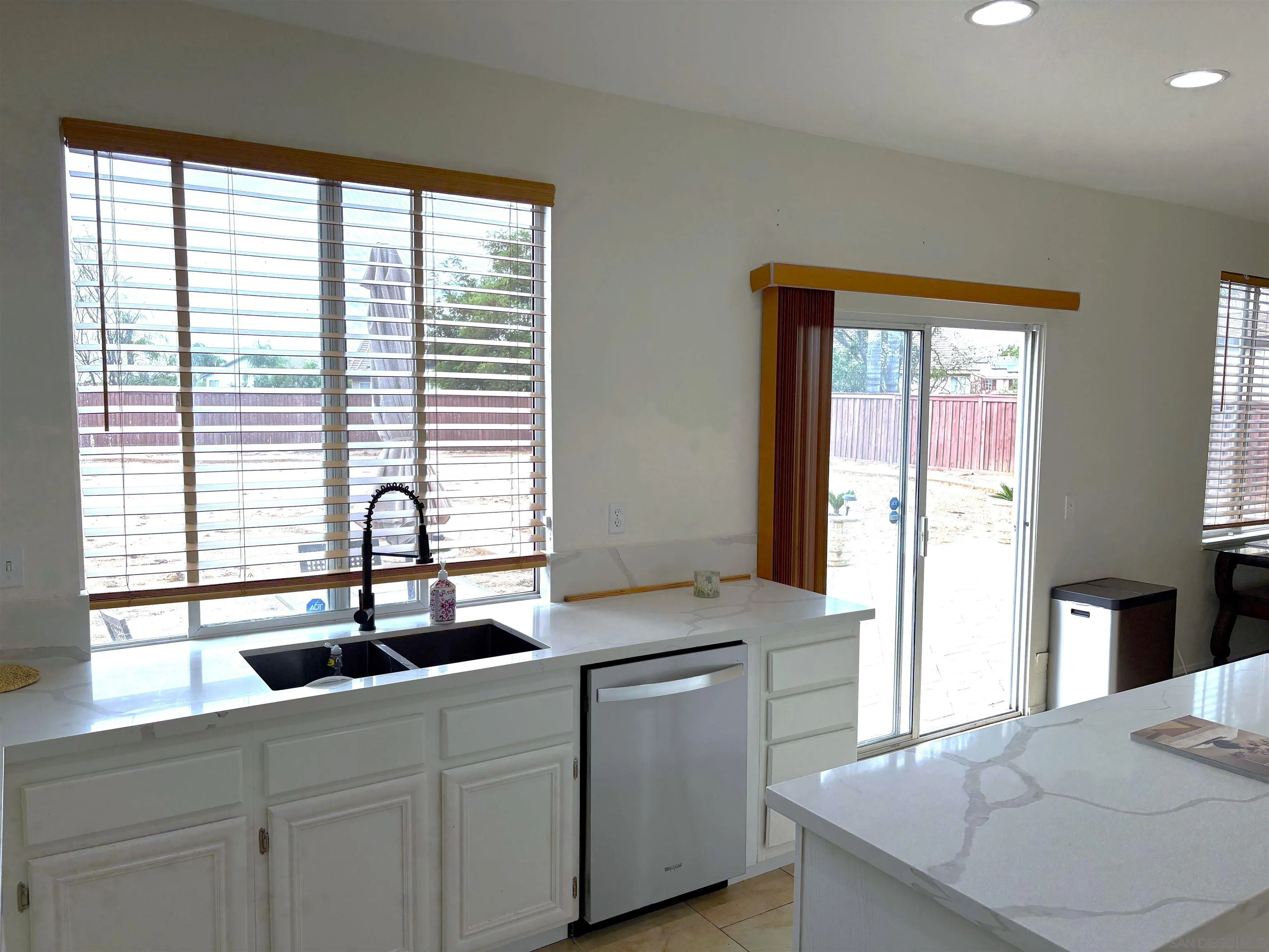 8873 Gumtree Lane Riverside, CA 92508 - Photo 11 of 36 a kitchen with counter top space sink and center
