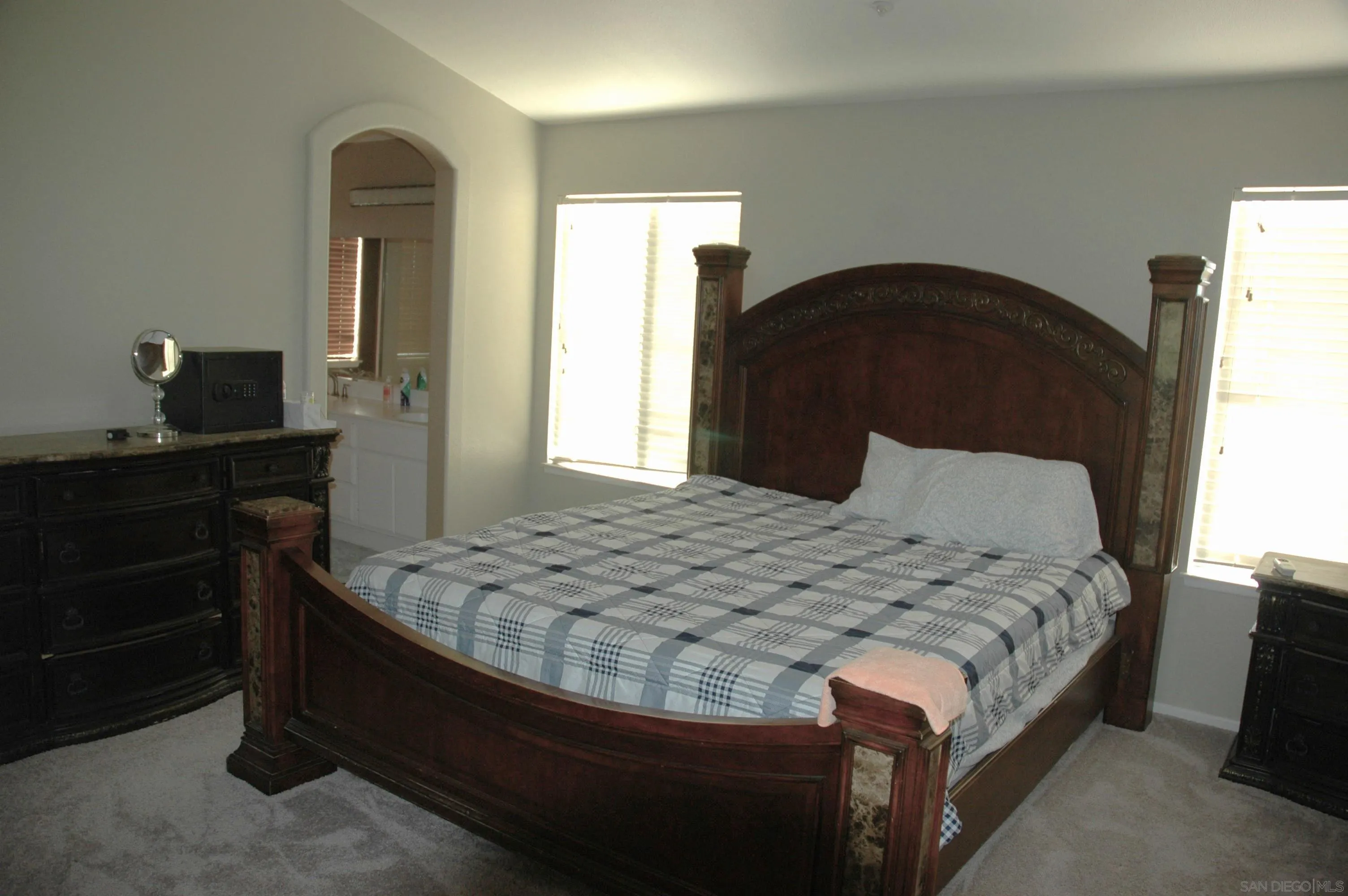 8873 Gumtree Lane Riverside, CA 92508 - Photo 17 of 36 a bedroom with a bed and a dresser