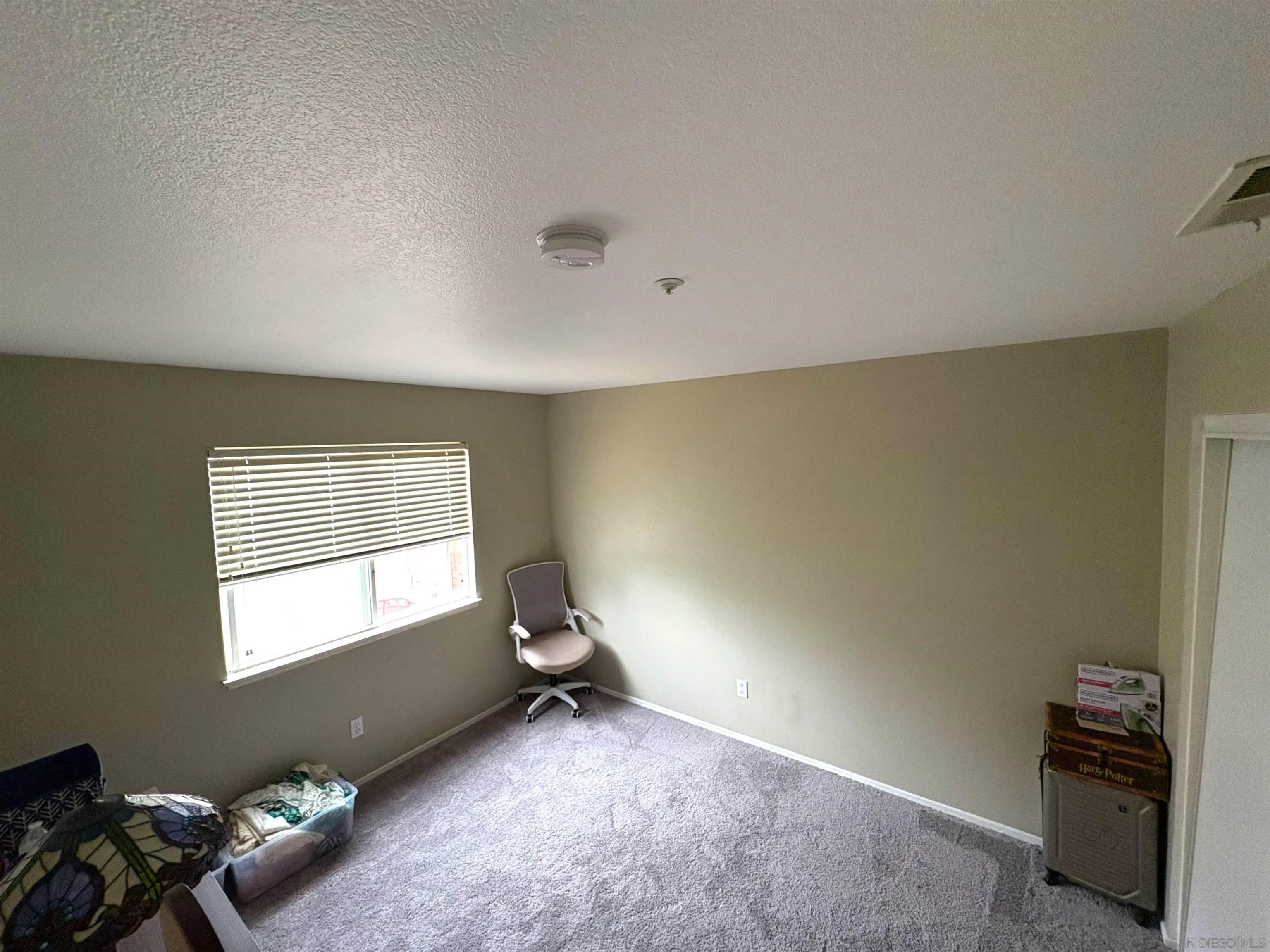8873 Gumtree Lane Riverside, CA 92508 - Photo 25 of 36 a view of a room with gym equipment and a window
