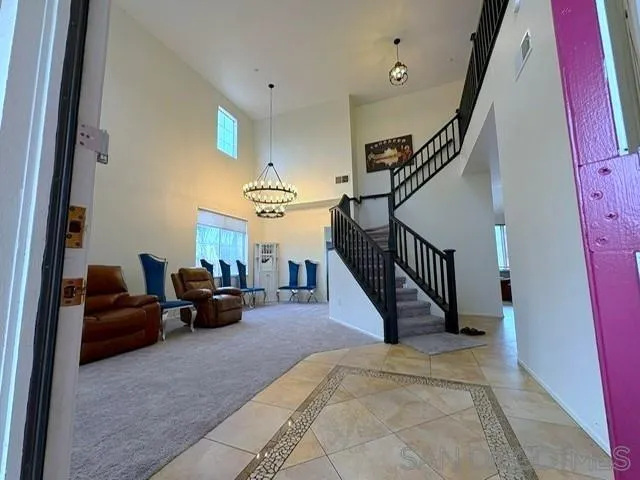 8873 Gumtree Lane Riverside, CA 92508 - Photo 5 of 36 a living room with furniture and stairs