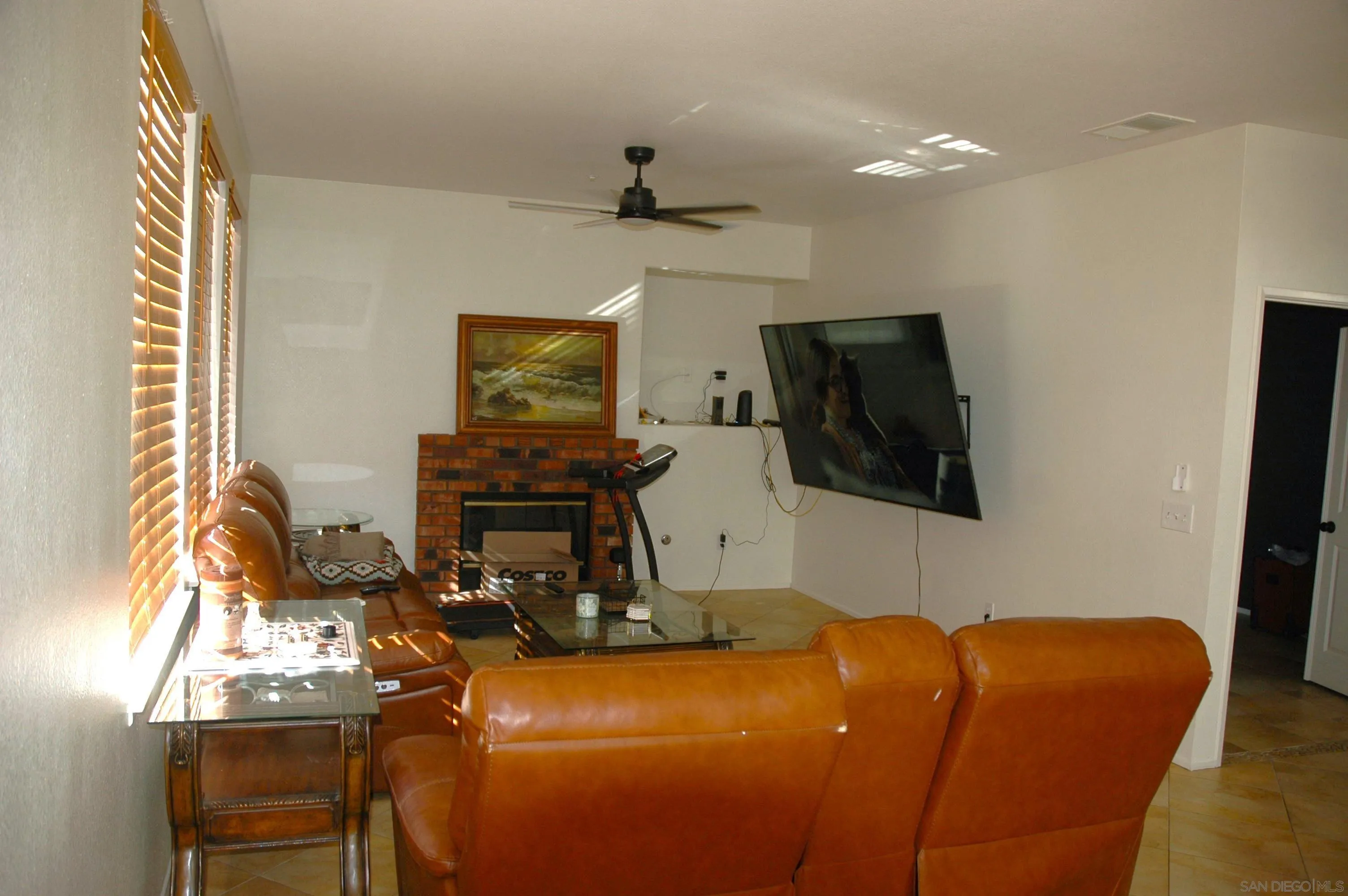 8873 Gumtree Lane Riverside, CA 92508 - Photo 9 of 36 a room with furniture a flat screen tv and a window
