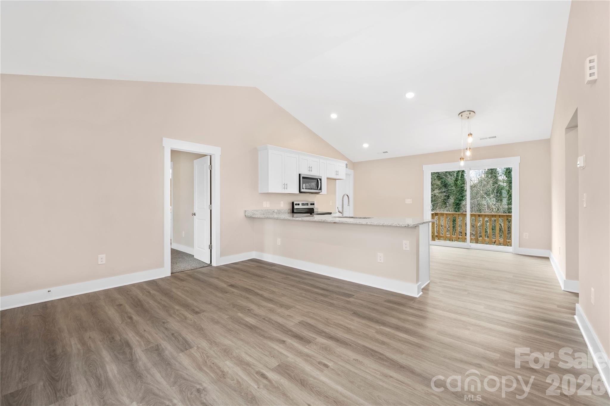 407 Queens Road Gastonia, NC 28052 - Photo 15 of 34 a view of kitchen with wooden floor and window