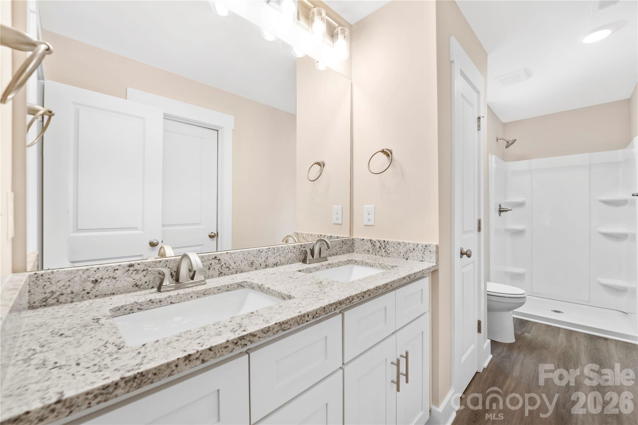 407 Queens Road Gastonia, NC 28052 - Photo 18 of 34 a bathroom with a granite countertop sink and a mirror