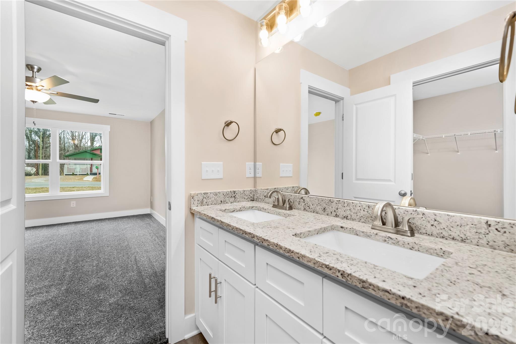 407 Queens Road Gastonia, NC 28052 - Photo 20 of 34 a bathroom with a granite countertop sink and a mirror