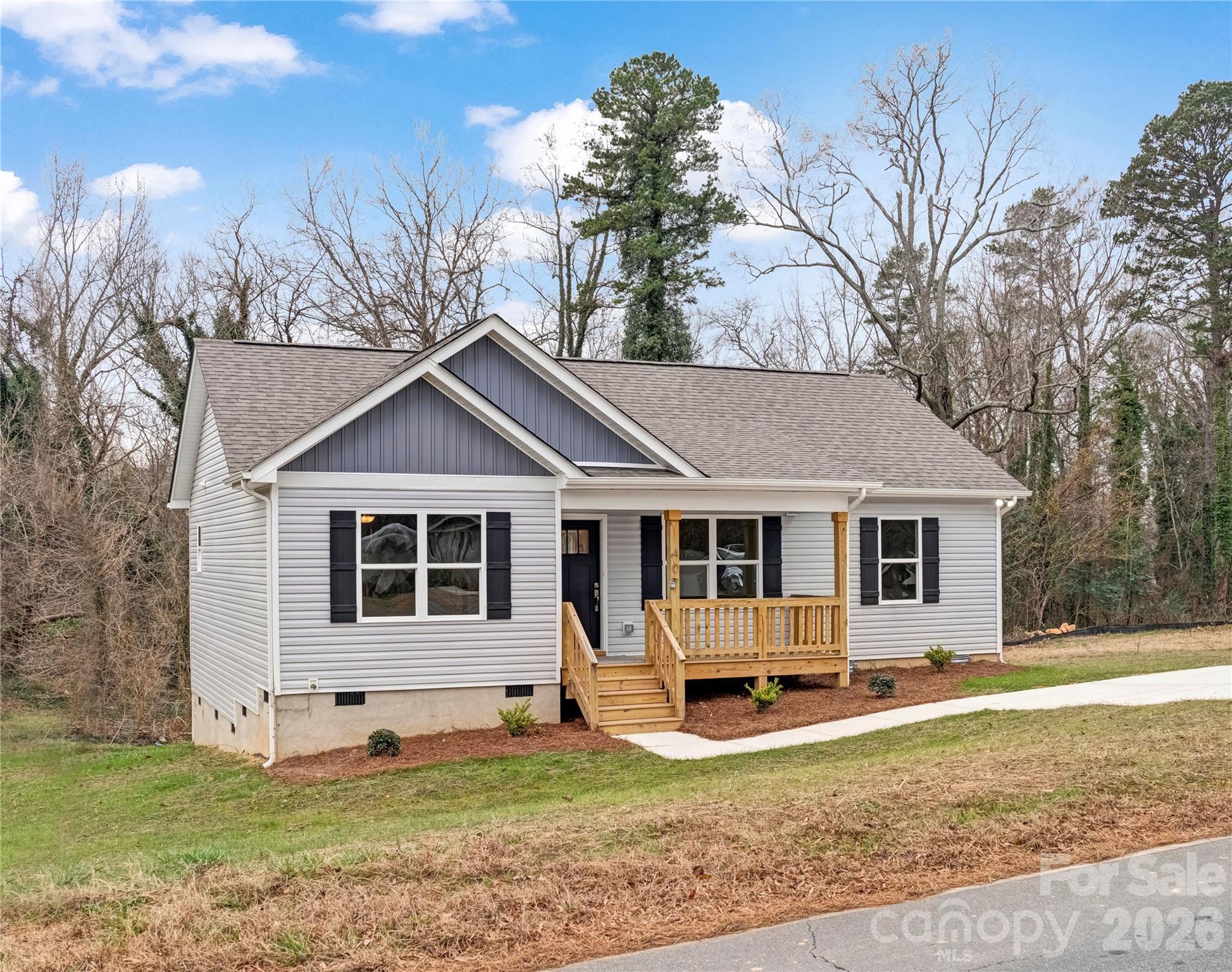 407 Queens Road Gastonia, NC 28052 - Photo 2 of 34 a view of a house with a yard and large trees