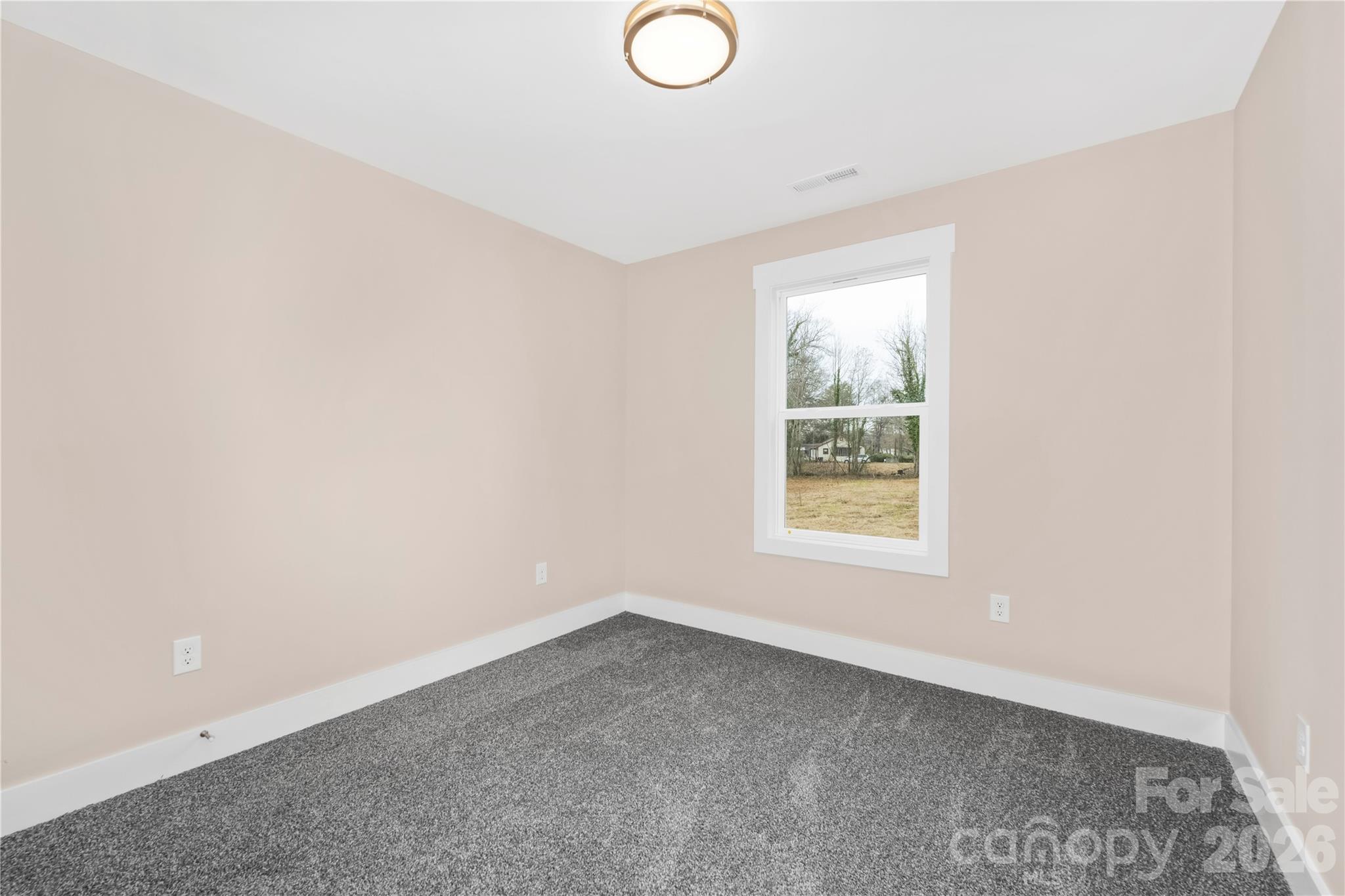 407 Queens Road Gastonia, NC 28052 - Photo 22 of 34 an empty room with a window