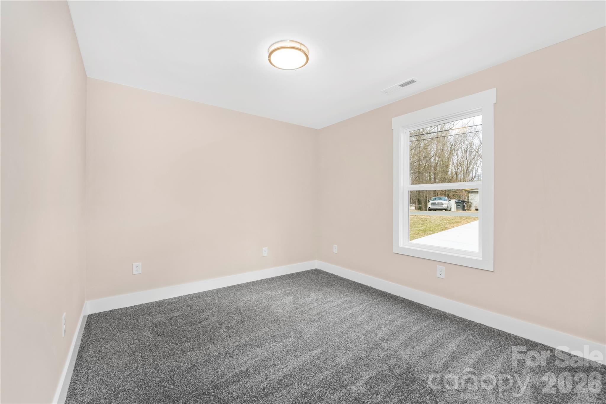 407 Queens Road Gastonia, NC 28052 - Photo 24 of 34 an empty room with a window