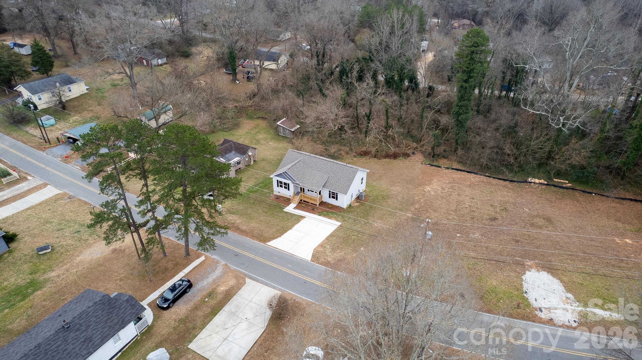 407 Queens Road Gastonia, NC 28052 - Photo 28 of 34 an aerial view of a house with a yard