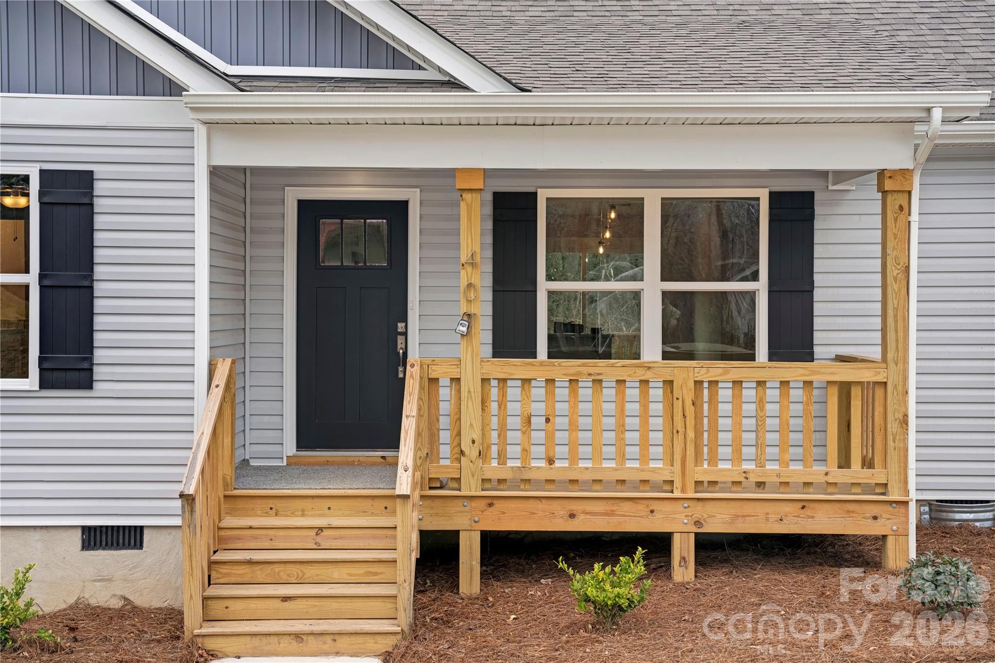 407 Queens Road Gastonia, NC 28052 - Photo 3 of 34 a front view of a house with a balcony