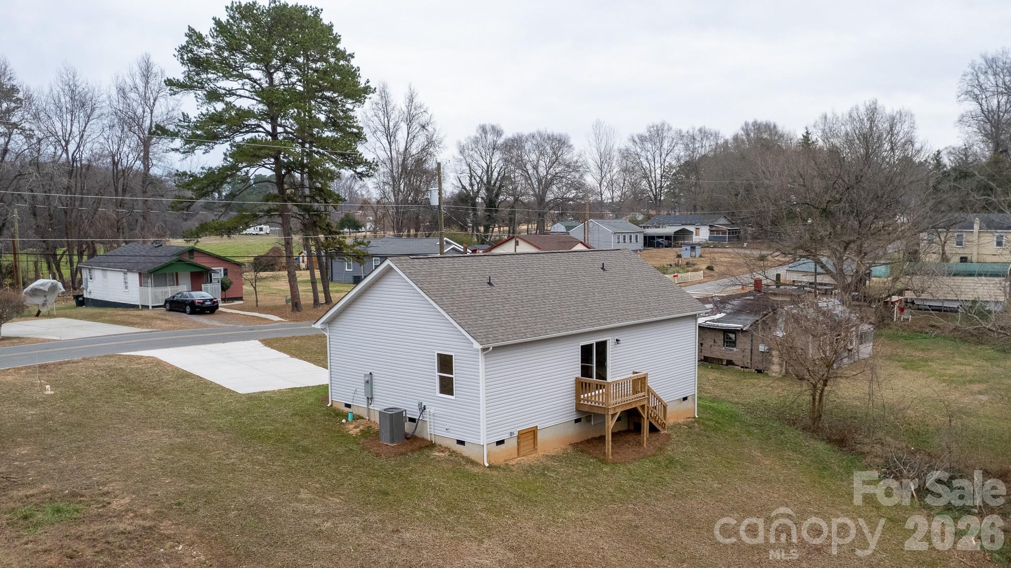 407 Queens Road Gastonia, NC 28052 - Photo 32 of 34 a aerial view of a house with a yard and sitting area