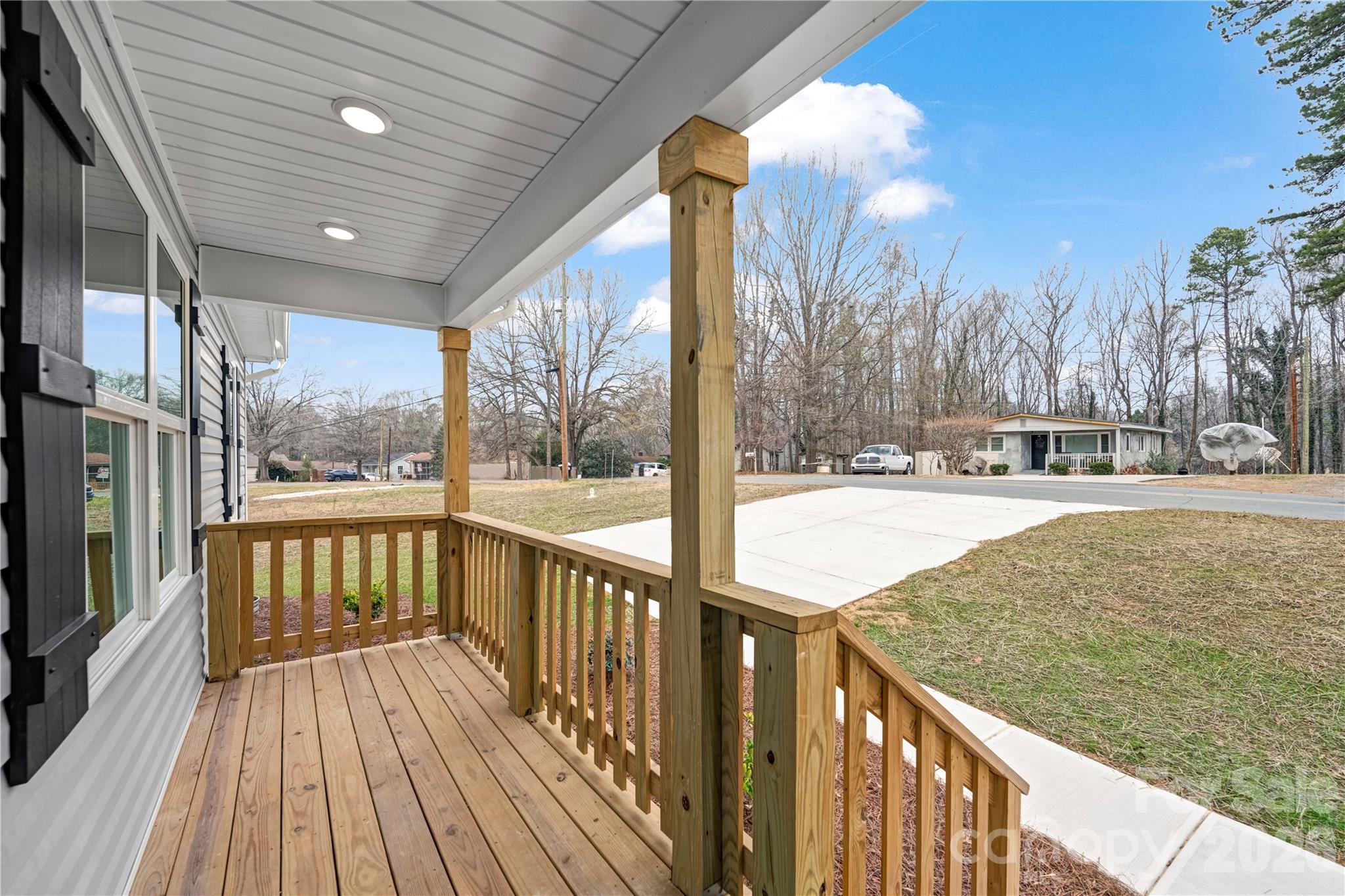 407 Queens Road Gastonia, NC 28052 - Photo 6 of 34 a view of balcony with wooden floor and fence