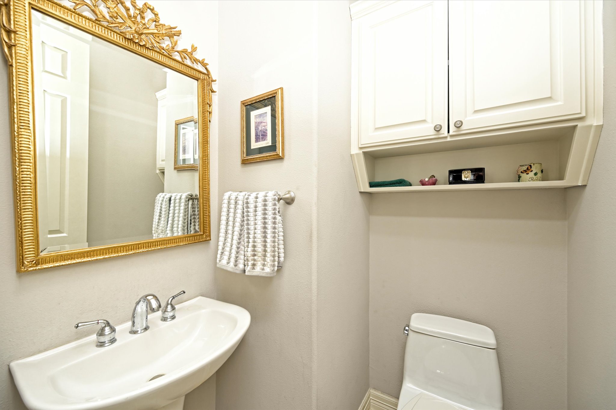 4912 Interlachen Lane Austin, TX 78747 - Photo 24 of 39 a bathroom with a sink and a mirror