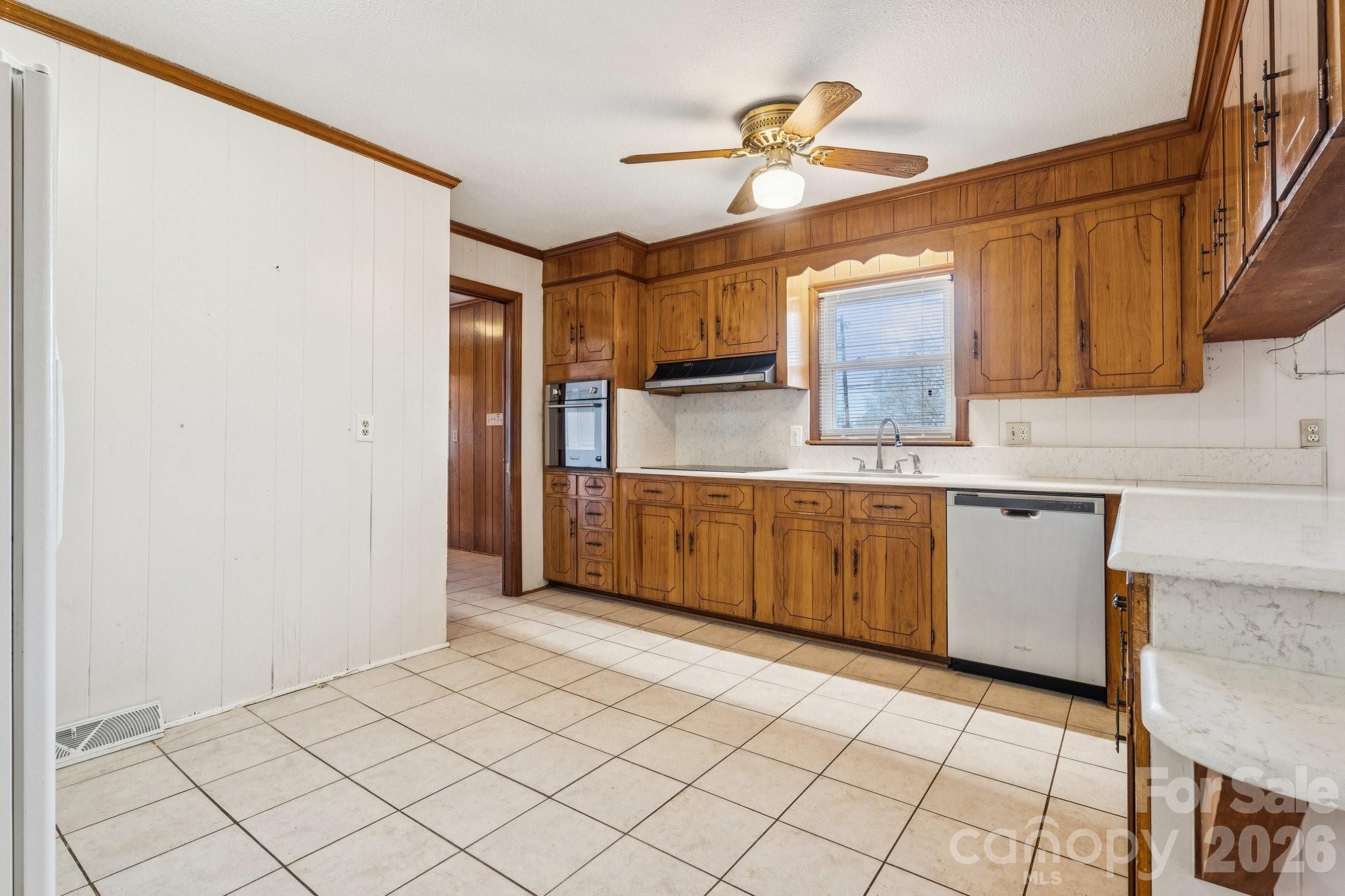 9525 Brief Road Charlotte, NC 28227 - Photo 17 of 46 a kitchen with stainless steel appliances a sink and a refrigerator