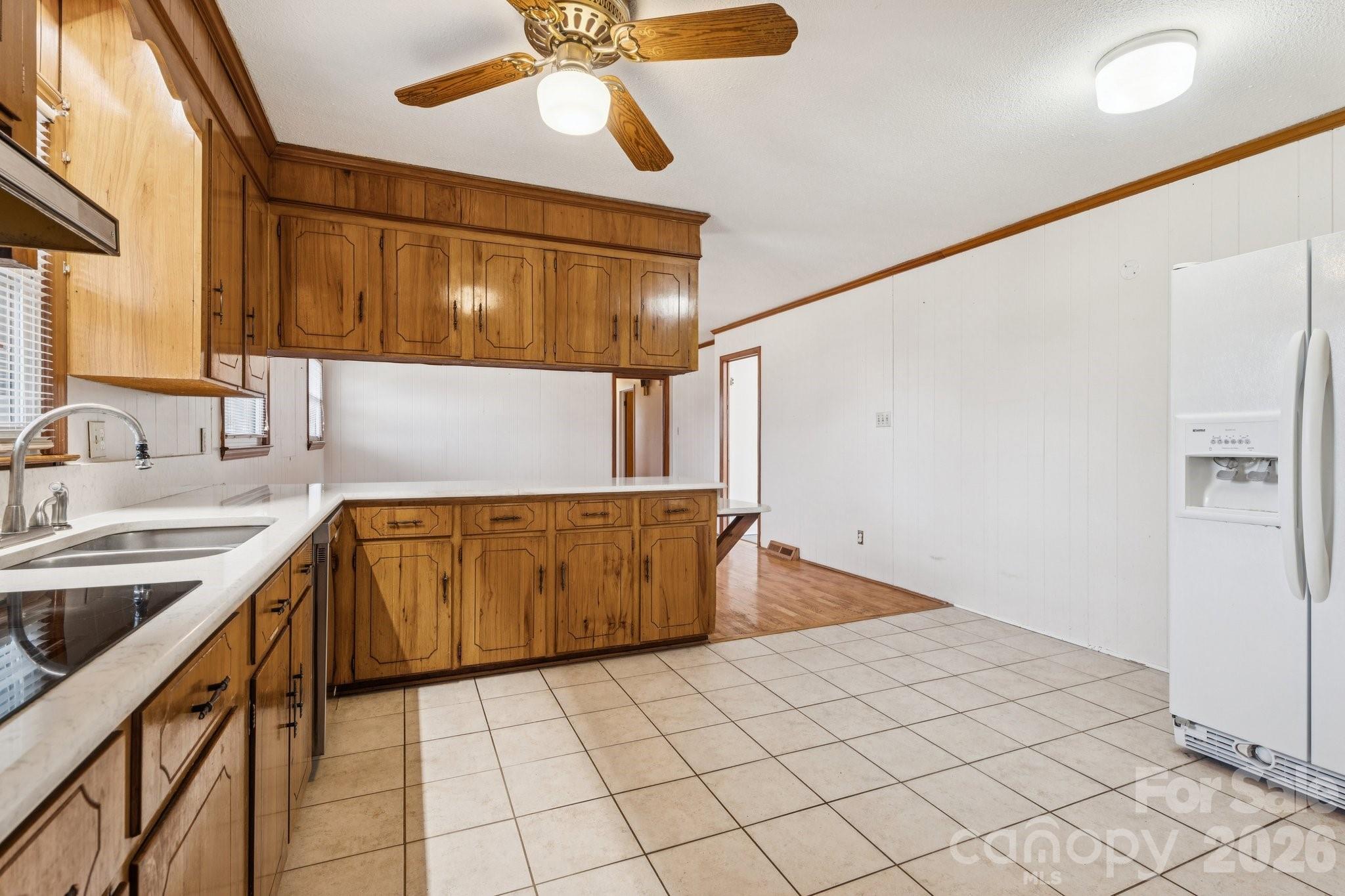 9525 Brief Road Charlotte, NC 28227 - Photo 19 of 46 a kitchen with a sink a stove cabinets and a counter top space