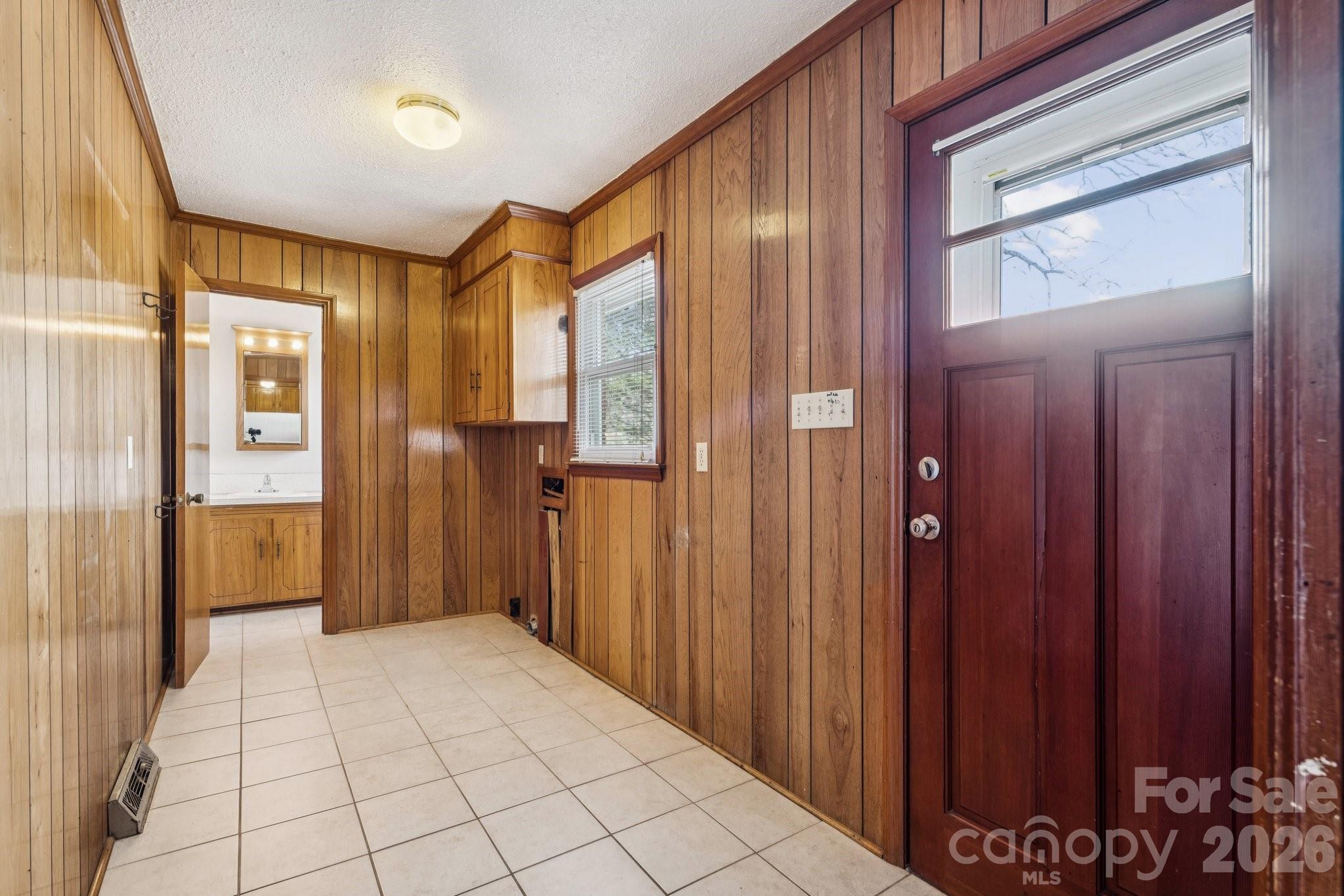 9525 Brief Road Charlotte, NC 28227 - Photo 20 of 46 a view of a hallway with a chandelier