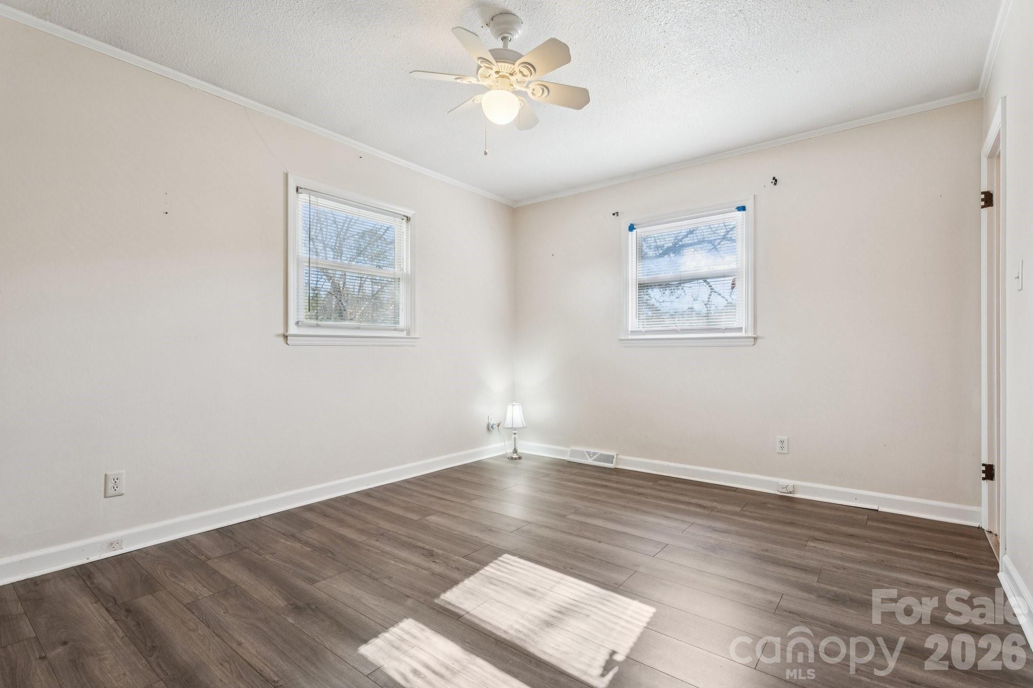 9525 Brief Road Charlotte, NC 28227 - Photo 26 of 46 a view of an empty room with window and a chandelier fan