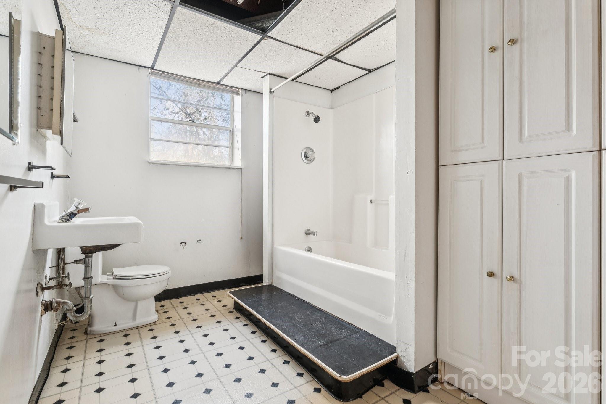 9525 Brief Road Charlotte, NC 28227 - Photo 32 of 46 a bathroom with a sink a toilet and shower