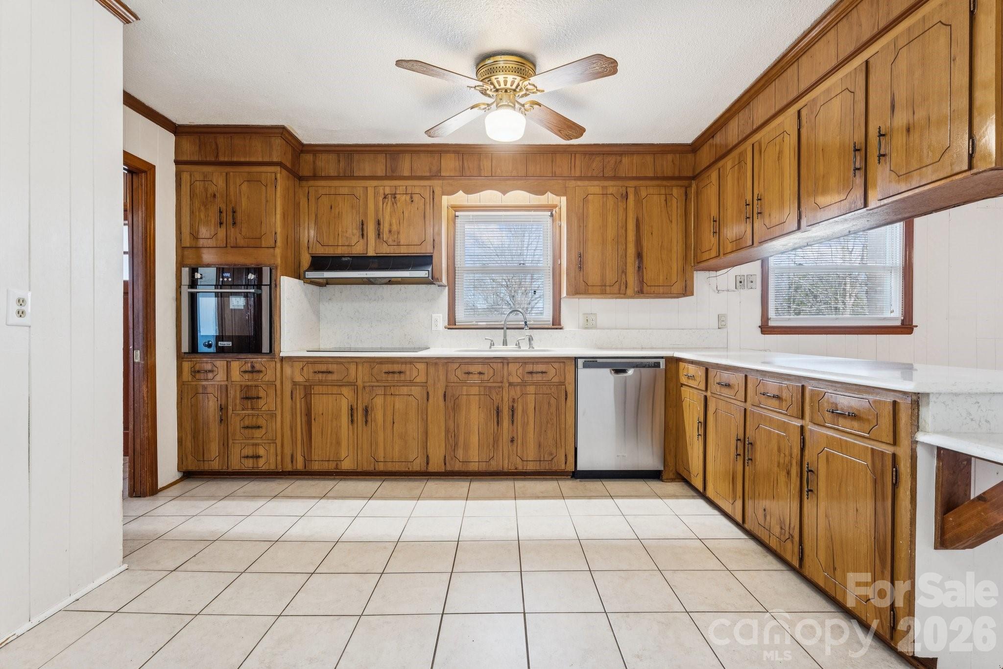 9525 Brief Road Charlotte, NC 28227 - Photo 35 of 46 a kitchen with stainless steel appliances granite countertop a stove a sink and dishwasher with cabinets