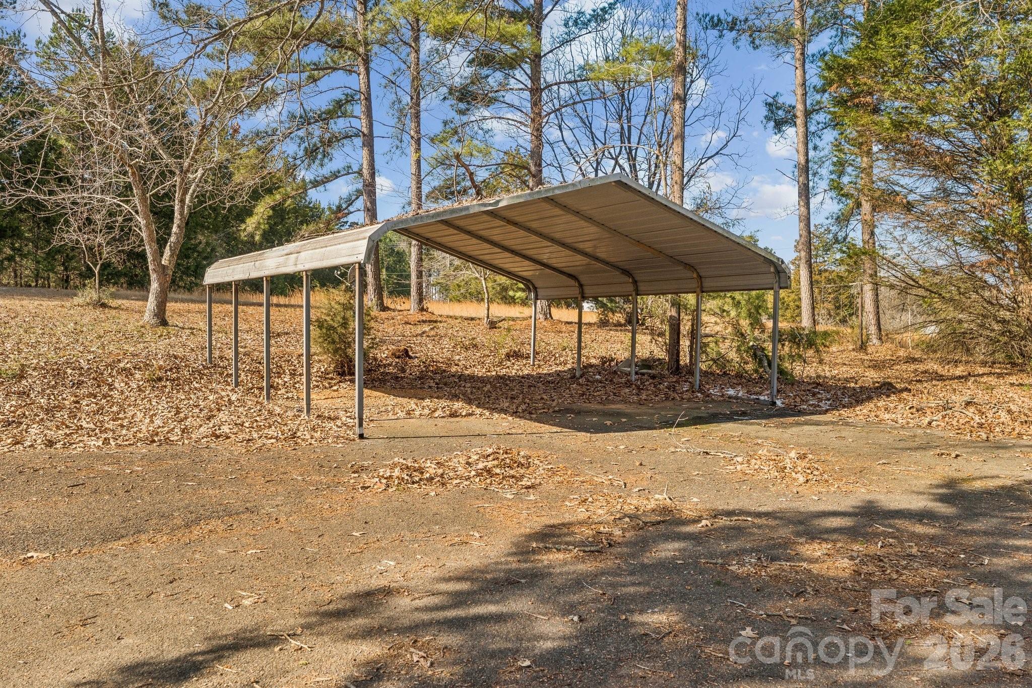 9525 Brief Road Charlotte, NC 28227 - Photo 37 of 46 a view of a house with a yard