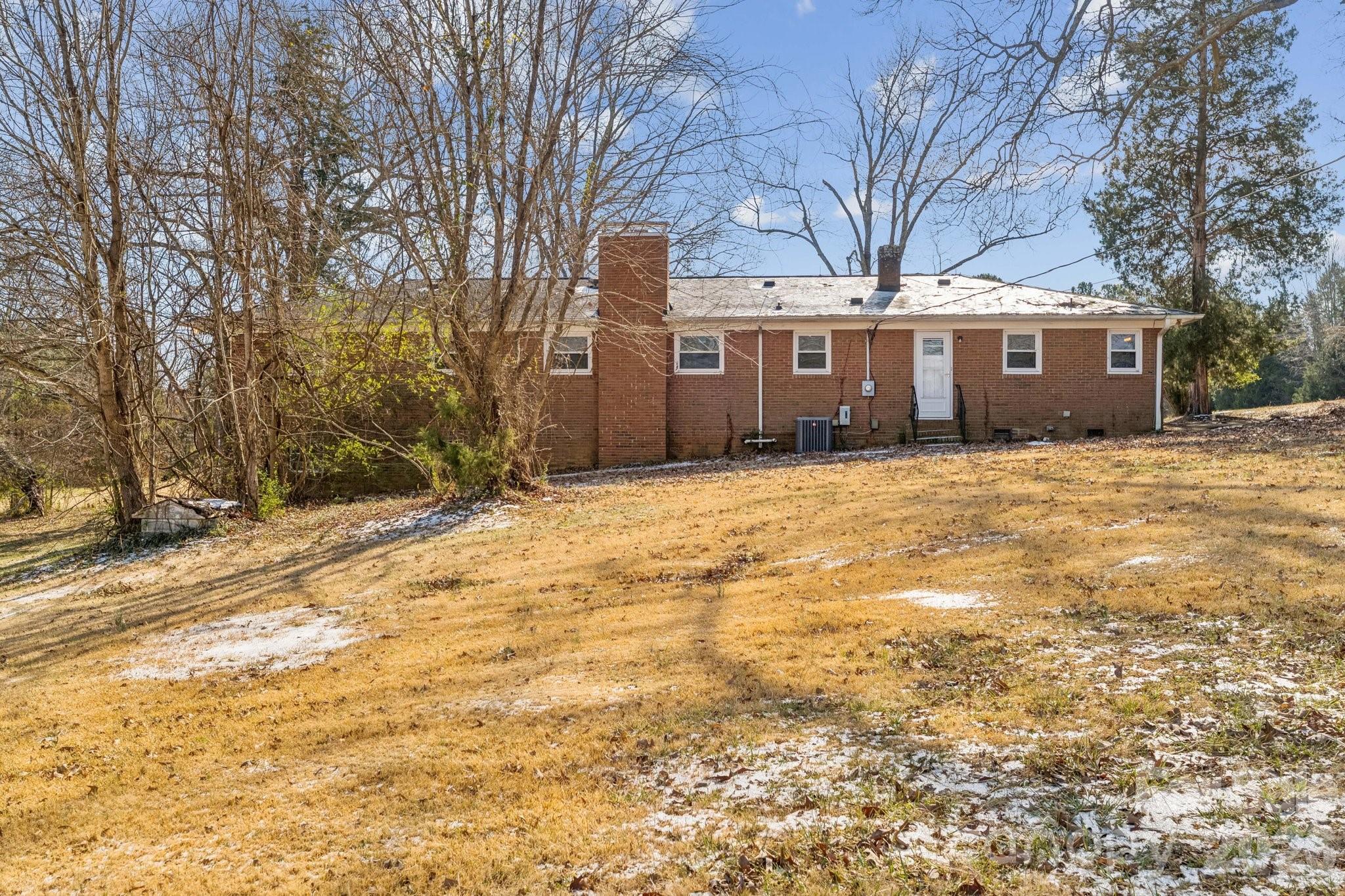9525 Brief Road Charlotte, NC 28227 - Photo 41 of 46 a front view of a house with a yard