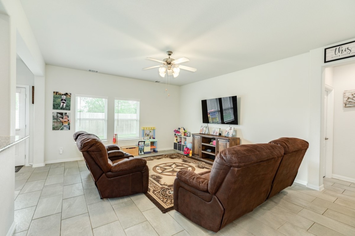 177 Bayou Bend Boulevard Angleton, TX 77515 - Photo 12 of 33 a living room with furniture and a flat screen tv