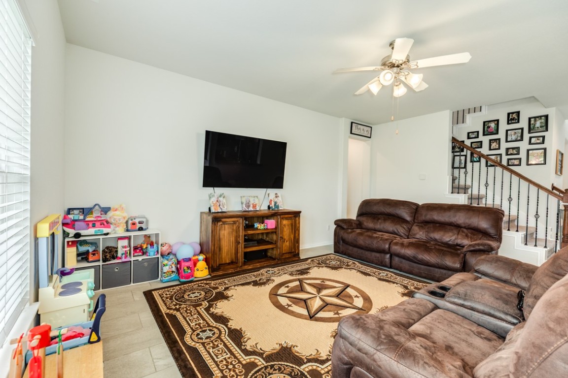 177 Bayou Bend Boulevard Angleton, TX 77515 - Photo 13 of 33 a living room with furniture and a flat screen tv
