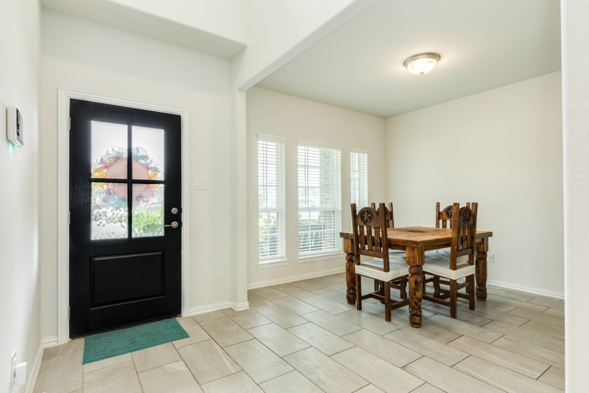 177 Bayou Bend Boulevard Angleton, TX 77515 - Photo 22 of 33 a dining room with furniture and window