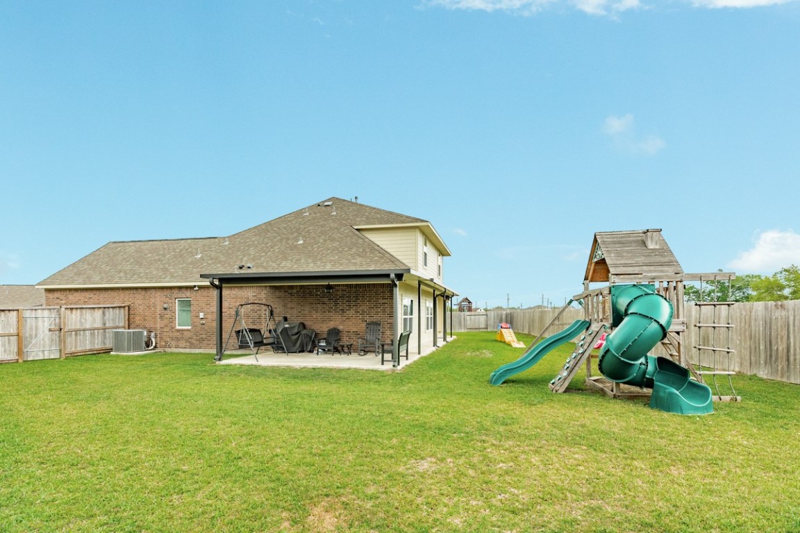 177 Bayou Bend Boulevard Angleton, TX 77515 - Photo 5 of 33 a house with garden in front of it