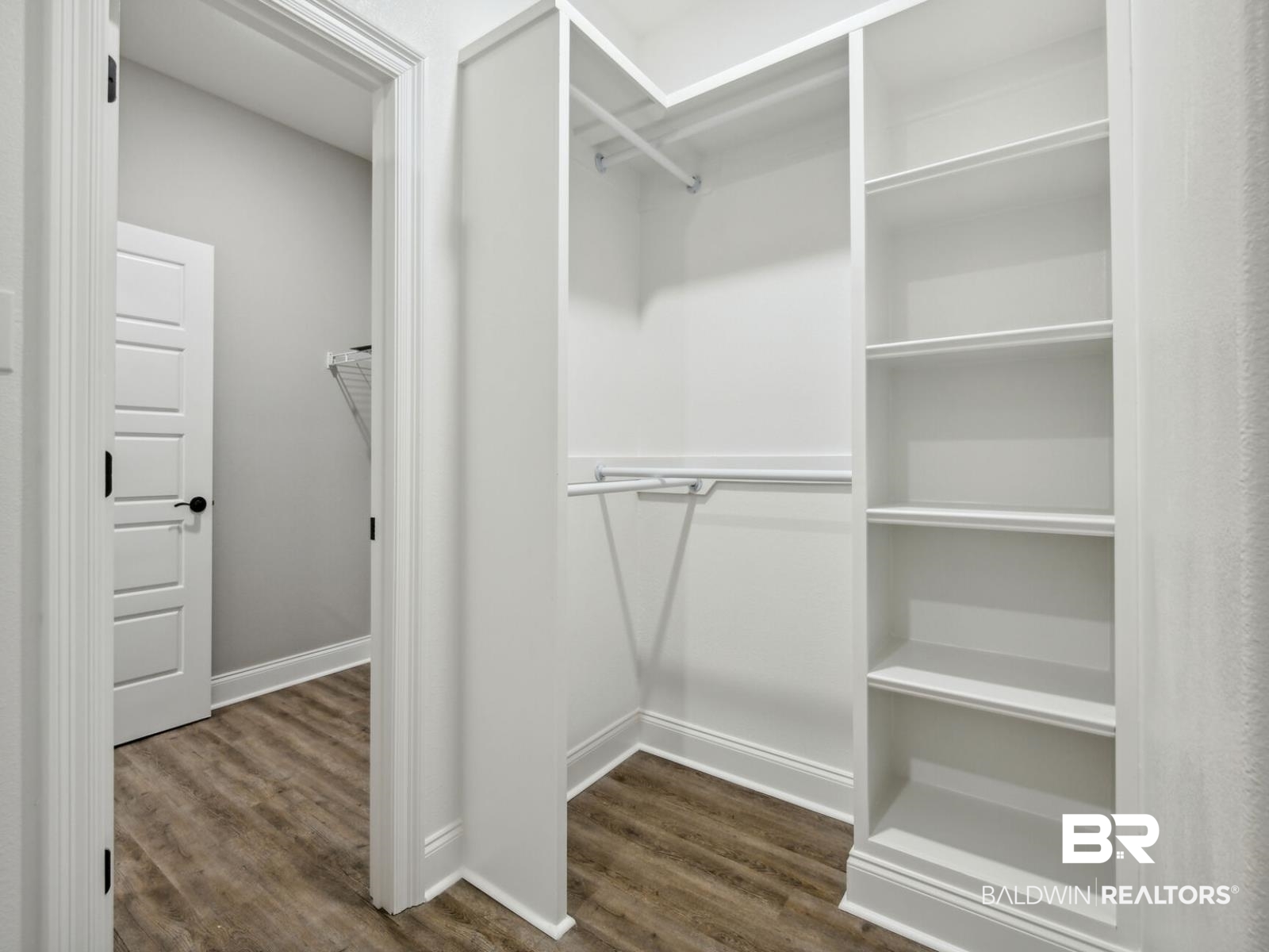 12943 Gondala Street Elberta, AL 36530 - Photo 13 of 23 Spacious closet with dark wood finished floors