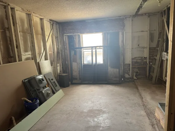 a view of livingroom with furniture and a window