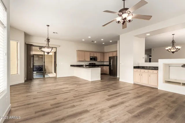 a view of a kitchen with a sink and a stove top oven