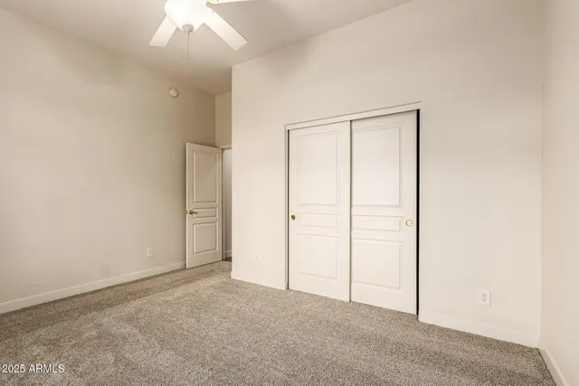 an empty room with closet area