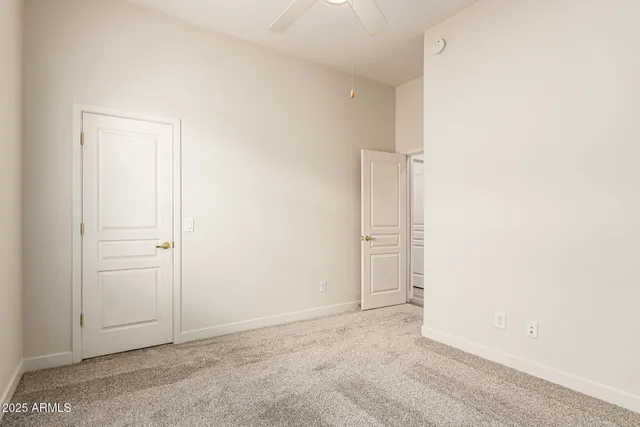 an empty room with closet area