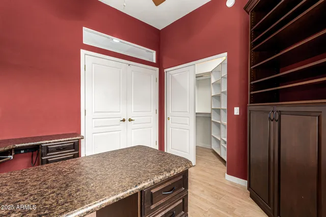a kitchen with a stove and a refrigerator