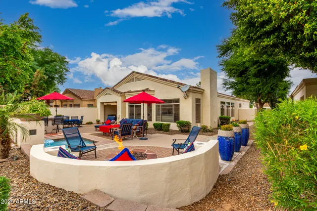 an outdoor space with patio furniture and white umbrellas