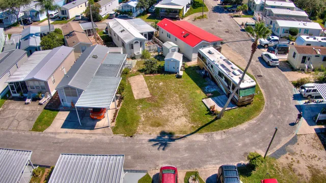 an aerial view of a houses with yard