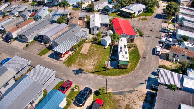 an aerial view of residential houses with outdoor space