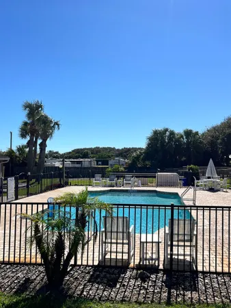 a view of a swimming pool with a garden