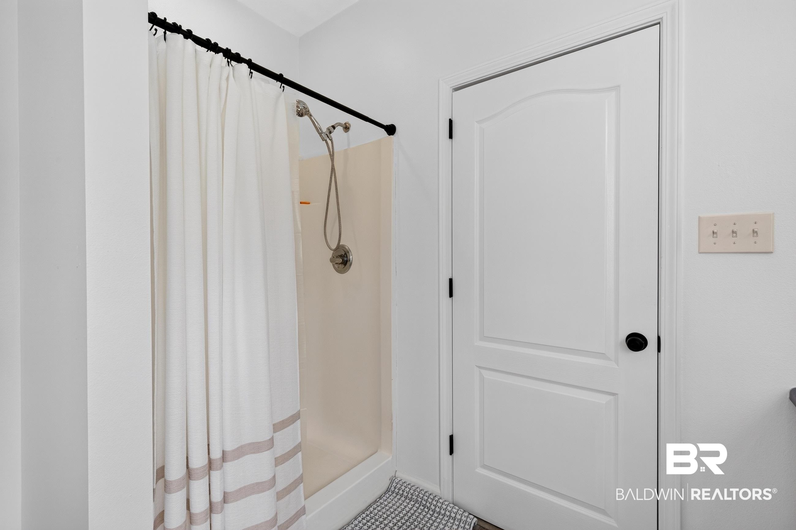 17419 Lewis Smith Drive Foley, AL 36535 - Photo 26 of 38 Shower with brushed nickel fixtures and a white enclosure