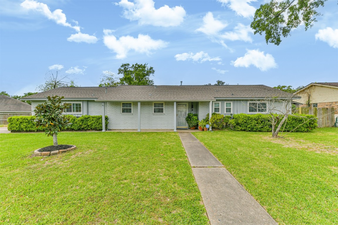 823 Townley Street Channelview, TX 77530 - Photo 2 of 29 a view of house in front of a big yard with large trees