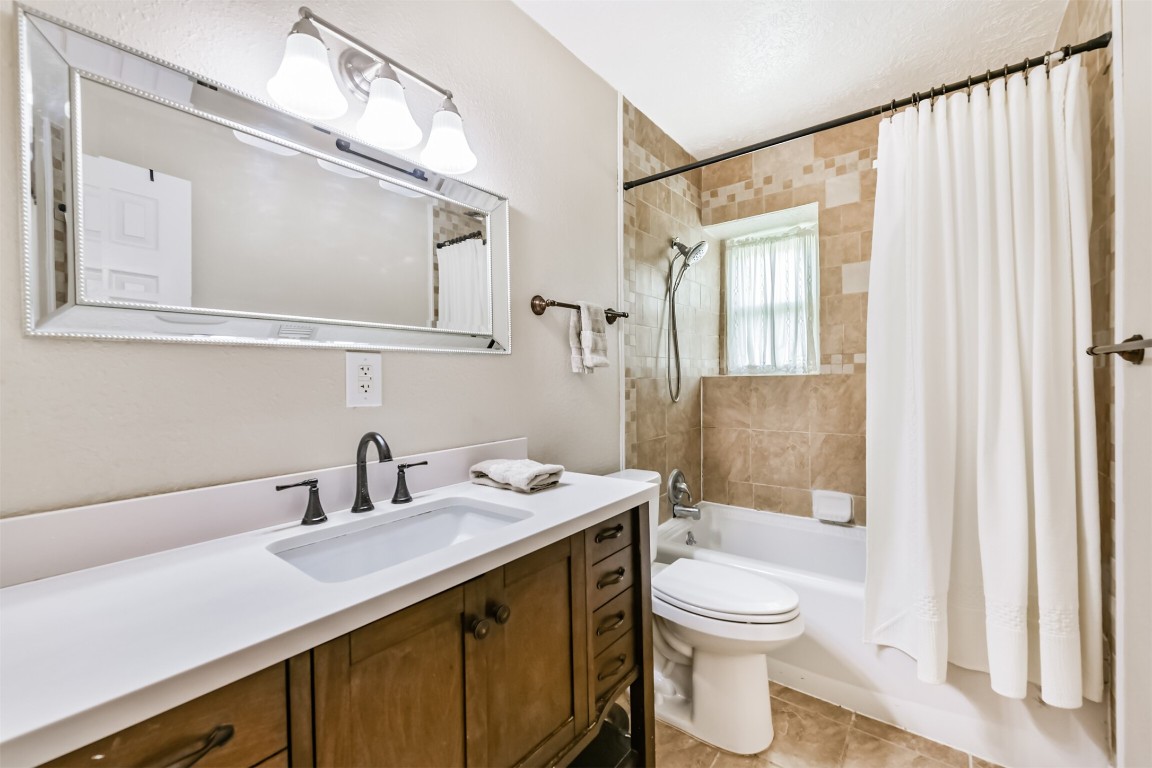 823 Townley Street Channelview, TX 77530 - Photo 21 of 29 a bathroom with a sink a toilet and shower