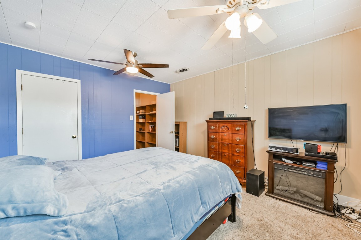 823 Townley Street Channelview, TX 77530 - Photo 23 of 29 a bedroom with a bed and a flat screen tv