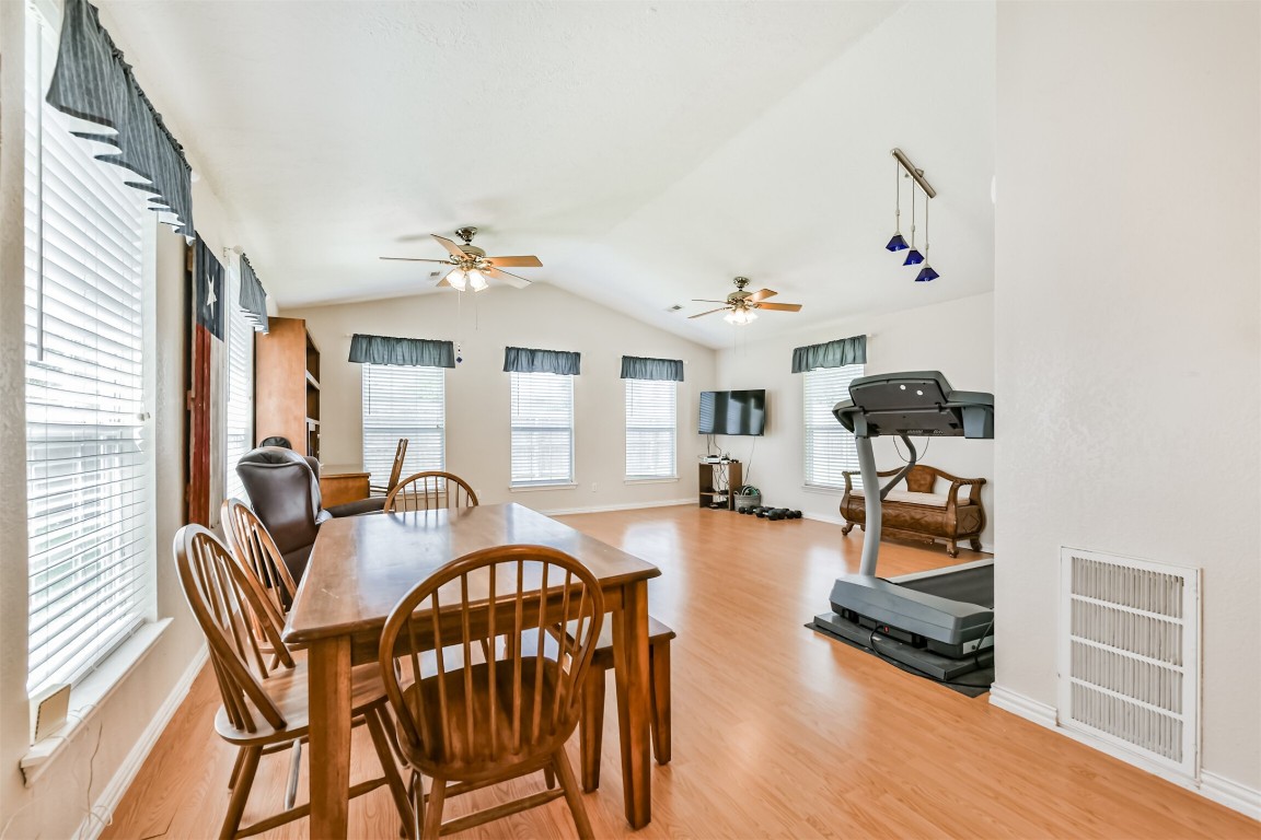 823 Townley Street Channelview, TX 77530 - Photo 10 of 29 a view of a livingroom with furniture wooden floor and chandelier