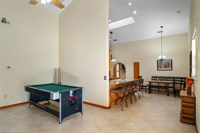 a reading room with furniture and wooden floor