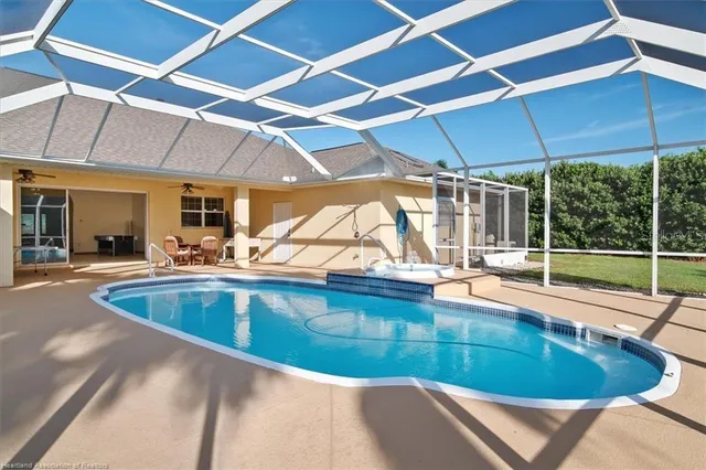 a view of a swimming pool with a patio