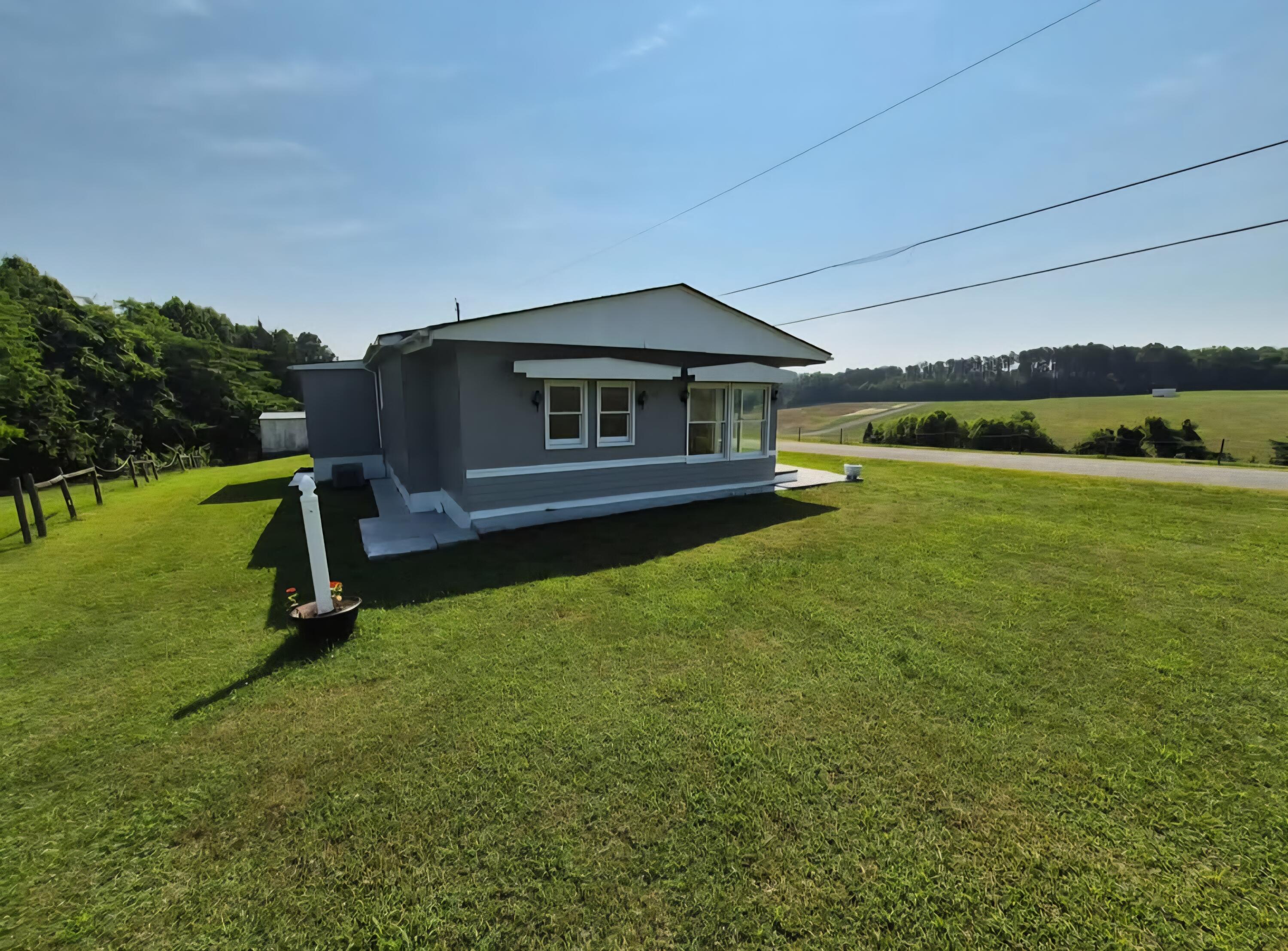 341 George Martin Drive Ridgeway, VA 24148 - Photo 5 of 11 a view of a house with a yard balcony and sitting area